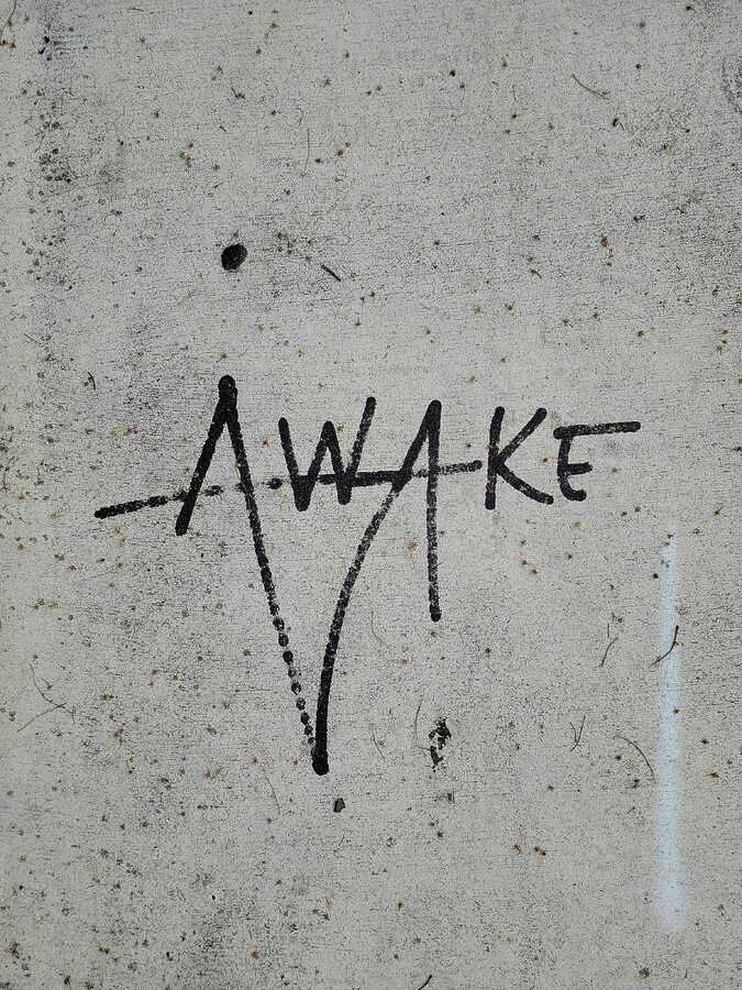 "Awake" written in black